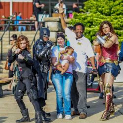 Group image of super-heros and event attendees